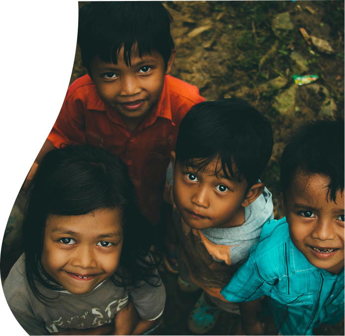Children looking up, representing support for grassroots NGOs